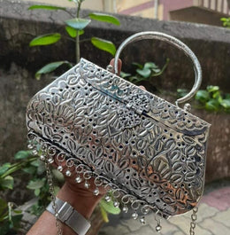 Silver color carving metal round clutch purse