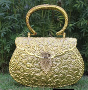 Round edge golden box clutch with carving