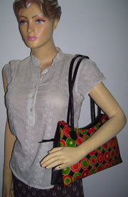 CIRCLE EMBOSS  ROUND CUT LEATHER BAG