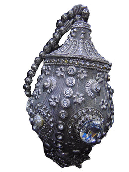 Round clutch bag in perforated-patterned