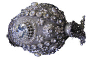 Round clutch bag in perforated-patterned