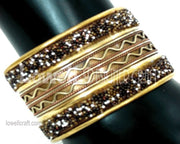 METAL CUFF WITH LEATHER CORD