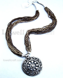 SEED BEAD NECKLACE WITH ANTIQUE METAL PENDANT